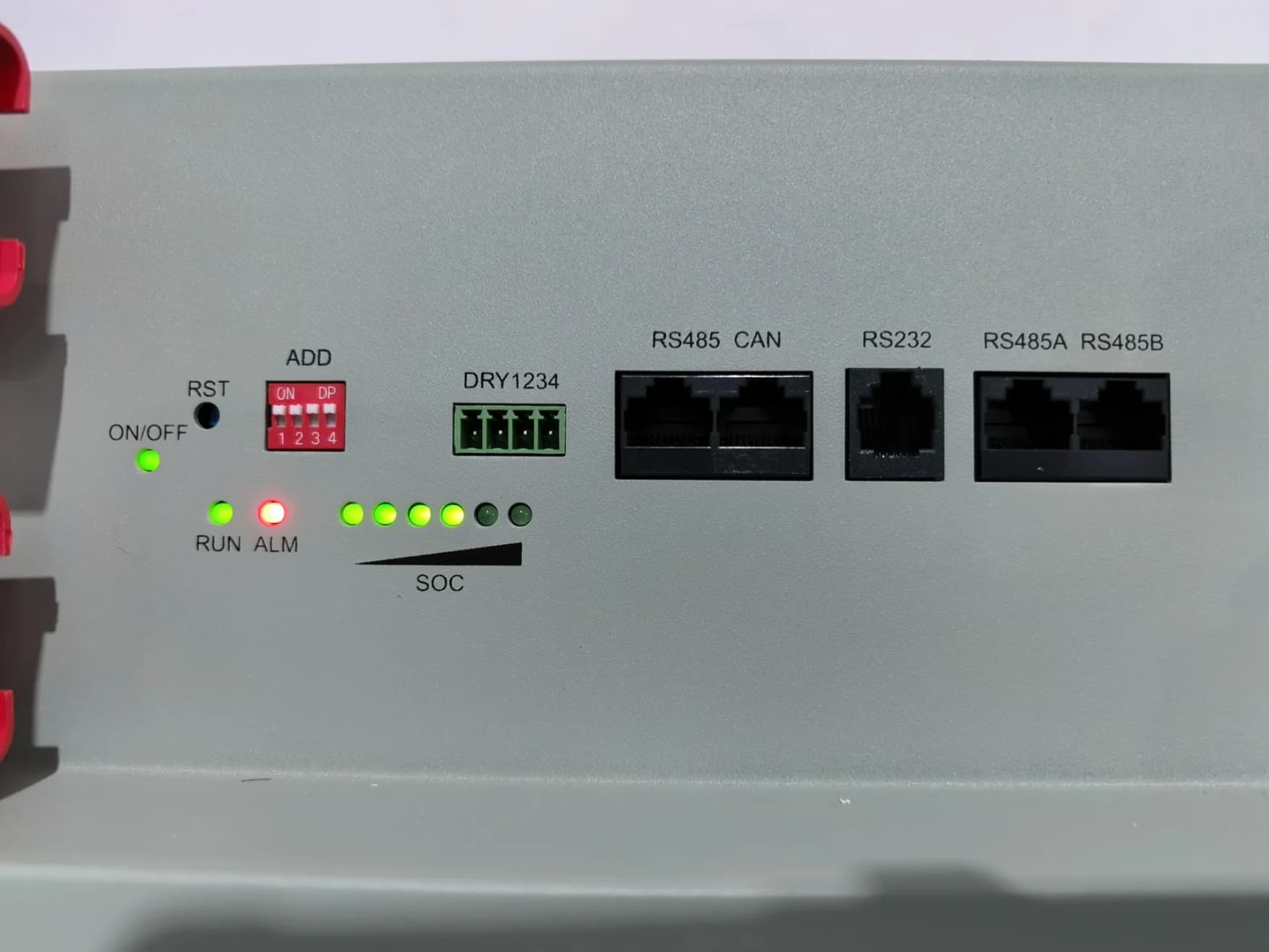 CAN RS485 RS232 dry-contact and address-switch ports on battery enclosure